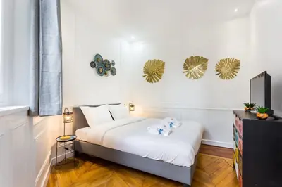 Un ou plusieurs lits dans un hébergement de l'établissement Appartement accueillant -1BR-6P - Auteuil - Passy