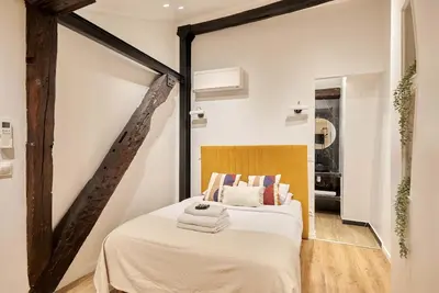Un ou plusieurs lits dans un hébergement de l'établissement Apartment Le Marais by Studio prestige