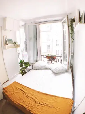 Un ou plusieurs lits dans un hébergement de l'établissement Green cozy studio au cœur de Paris