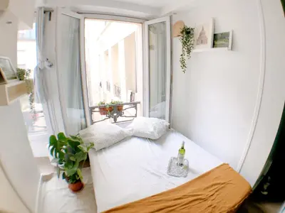 Un ou plusieurs lits dans un hébergement de l'établissement Green cozy studio au cœur de Paris