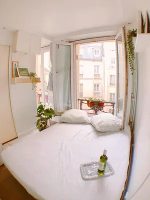Un ou plusieurs lits dans un hébergement de l'établissement Green cozy studio au cœur de Paris
