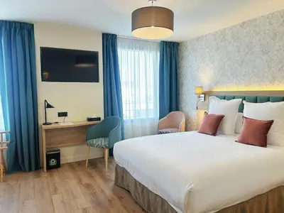 Un ou plusieurs lits dans un hébergement de l'établissement Hôtel Oden Paris Ivry