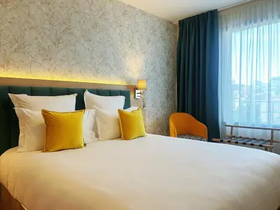 Un ou plusieurs lits dans un hébergement de l'établissement Hôtel Oden Paris Ivry
