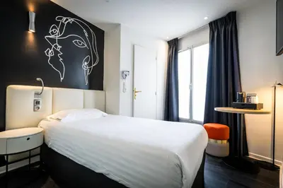 Un ou plusieurs lits dans un hébergement de l'établissement Hôtel Montparnasse Saint Germain