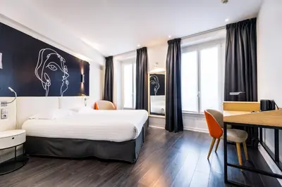 Un ou plusieurs lits dans un hébergement de l'établissement Hôtel Montparnasse Saint Germain