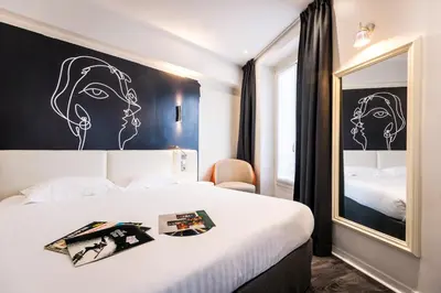 Un ou plusieurs lits dans un hébergement de l'établissement Hôtel Montparnasse Saint Germain