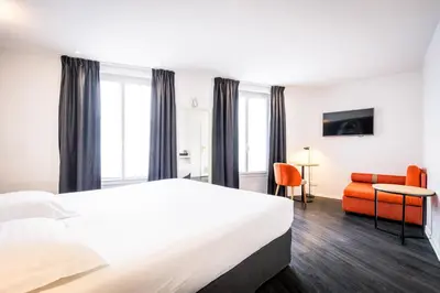 Un ou plusieurs lits dans un hébergement de l'établissement Hôtel Montparnasse Saint Germain