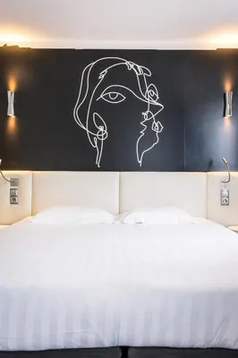 Un ou plusieurs lits dans un hébergement de l'établissement Hôtel Montparnasse Saint Germain