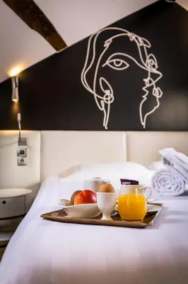 Un ou plusieurs lits dans un hébergement de l'établissement Hôtel Montparnasse Saint Germain