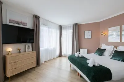 Un ou plusieurs lits dans un hébergement de l'établissement Sweet'Issy - Balcon - Parking - Climatisation - WIFI - MyBestLoc