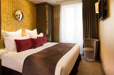 Un ou plusieurs lits dans un hébergement de l'établissement Hôtel Baume