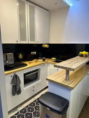 Cuisine ou kitchenette dans l'établissement Charmant 3 pièces Champs-Elysées, Ternes, Porte Maillot, 17ème