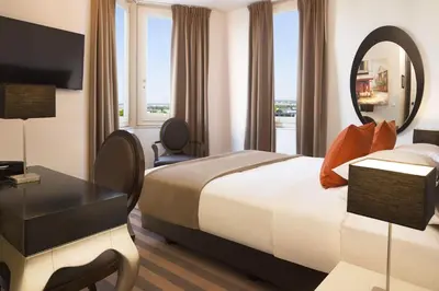 Un ou plusieurs lits dans un hébergement de l'établissement Executive Hôtel Paris Gennevilliers
