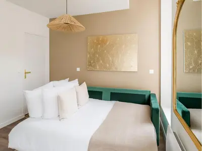 Un ou plusieurs lits dans un hébergement de l'établissement Merveil - Family Suite - Marais - Fbg St Antoine