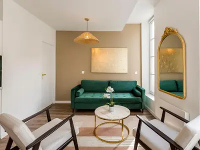 Coin salon dans l'établissement Merveil - Family Suite - Marais - Fbg St Antoine