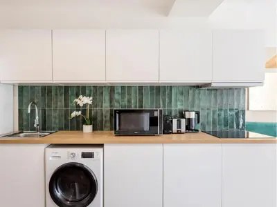 Cuisine ou kitchenette dans l'établissement Merveil - Family Suite - Marais - Fbg St Antoine