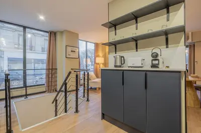 Cuisine ou kitchenette dans l'établissement Résidence Le Belleville