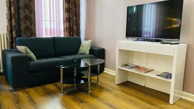 Télévision ou salle de divertissement dans l'établissement Hôtel Paris Gambetta