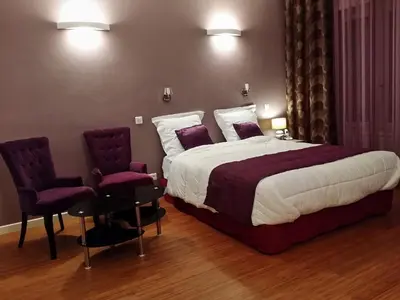 Un ou plusieurs lits dans un hébergement de l'établissement Hôtel Paris Gambetta