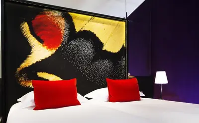 Un ou plusieurs lits dans un hébergement de l'établissement Hotel de Seze