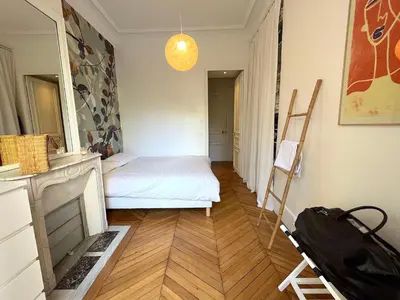 Un ou plusieurs lits dans un hébergement de l'établissement L'appartement Michel-Ange