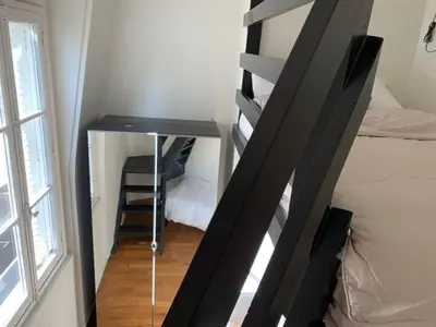 Un ou plusieurs lits dans un hébergement de l'établissement Appartement 3 chambres Paris 7e