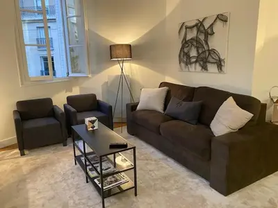 Coin salon dans l'établissement Appartement 3 chambres Paris 7e
