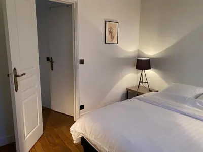 Un ou plusieurs lits dans un hébergement de l'établissement Appartement 3 chambres Paris 7e