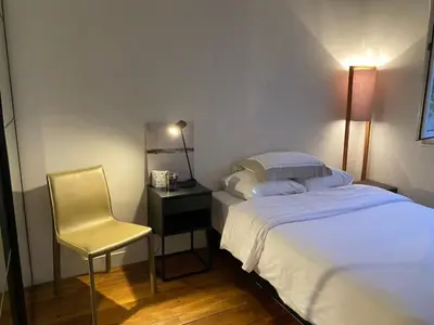 Un ou plusieurs lits dans un hébergement de l'établissement Appartement 3 chambres Paris 7e