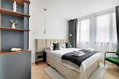 Un ou plusieurs lits dans un hébergement de l'établissement Cosy apartment 2BR-6P Champs Elysées