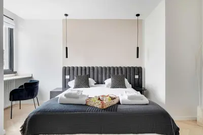 Un ou plusieurs lits dans un hébergement de l'établissement Cosy apartment 2BR-6P Champs Elysées