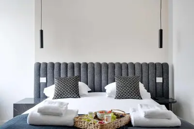 Un ou plusieurs lits dans un hébergement de l'établissement Cosy apartment 2BR-6P Champs Elysées