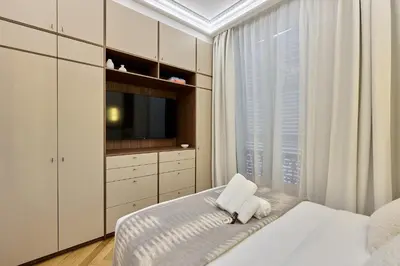 Un ou plusieurs lits dans un hébergement de l'établissement Apartment Matignon by Studio prestige