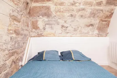 Un ou plusieurs lits dans un hébergement de l'établissement Apartment lyonnais center of paris