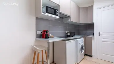 Cuisine ou kitchenette dans l'établissement Nid d'amour