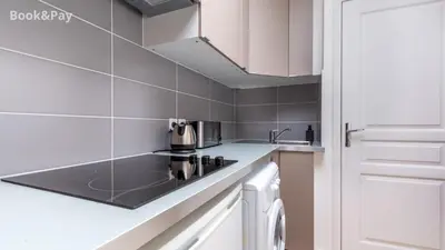 Cuisine ou kitchenette dans l'établissement Nid d'amour