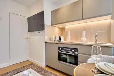 Cuisine ou kitchenette dans l'établissement Elegant Studio Bastille - Le Marais