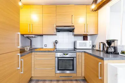 Cuisine ou kitchenette dans l'établissement GuestReady - Appartement Cosy au Cœur de Paris