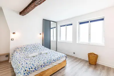 Un ou plusieurs lits dans un hébergement de l'établissement GuestReady - Appartement Cosy au Cœur de Paris