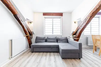Coin salon dans l'établissement GuestReady - Appartement Cosy au Cœur de Paris