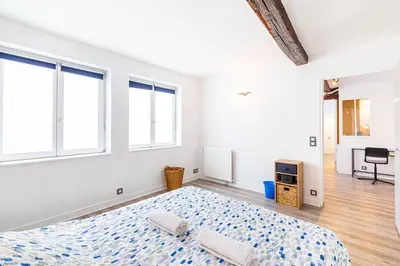 Un ou plusieurs lits dans un hébergement de l'établissement GuestReady - Appartement Cosy au Cœur de Paris