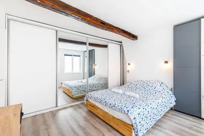 Un ou plusieurs lits dans un hébergement de l'établissement GuestReady - Appartement Cosy au Cœur de Paris