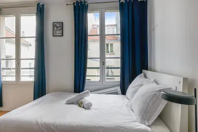 Un ou plusieurs lits dans un hébergement de l'établissement Appartement Garnet - Welkeys