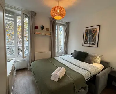 Un ou plusieurs lits dans un hébergement de l'établissement Clichy studio Getaway - C70