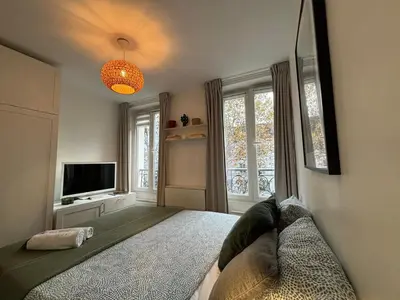 Un ou plusieurs lits dans un hébergement de l'établissement Clichy studio Getaway - C70