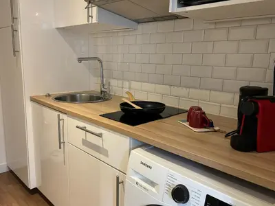 Cuisine ou kitchenette dans l'établissement Clichy studio Getaway - C70