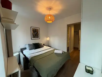 Un ou plusieurs lits dans un hébergement de l'établissement Clichy studio Getaway - C70