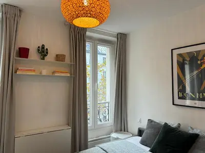 Un ou plusieurs lits dans un hébergement de l'établissement Clichy studio Getaway - C70