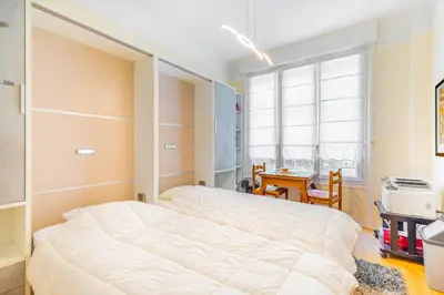 Un ou plusieurs lits dans un hébergement de l'établissement GuestReady - Luxe et confort à Paris