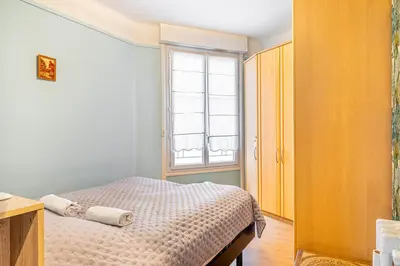 Un ou plusieurs lits dans un hébergement de l'établissement GuestReady - Luxe et confort à Paris